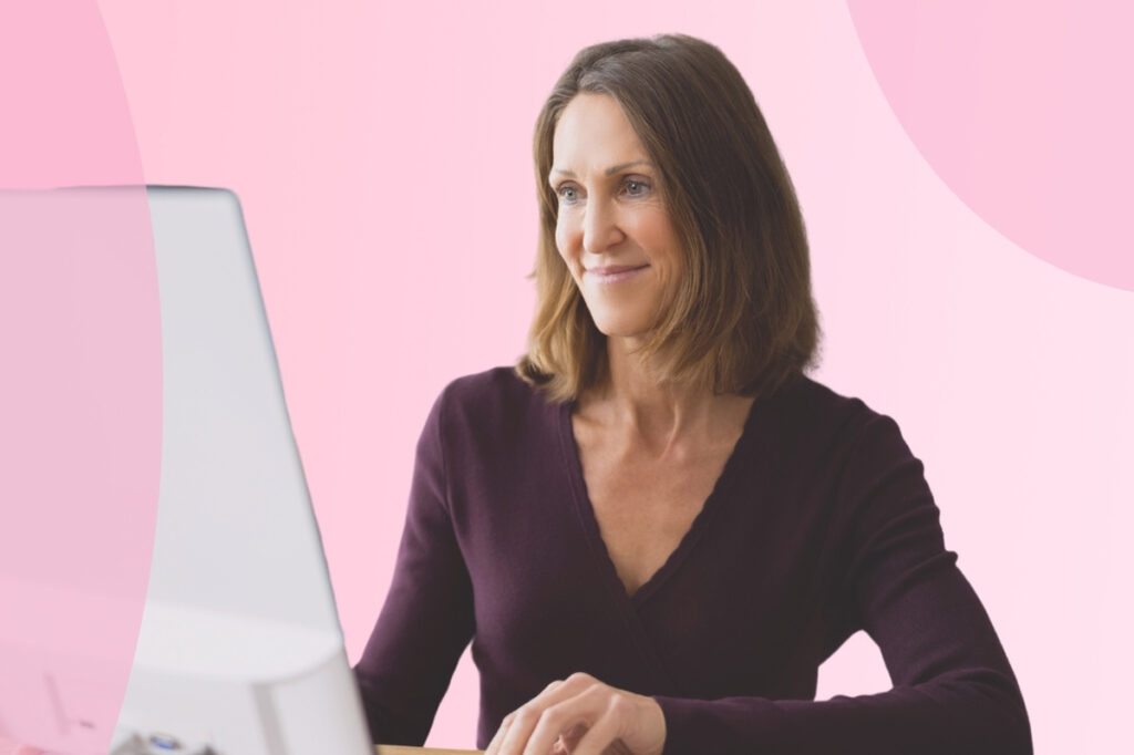 Female coach using a desktop computer