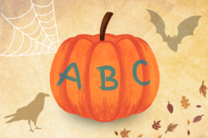 pumpkin with ABC written on it with raven and bat shadow